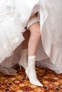 A leg of the bride in a boot Royalty Free Stock Photo