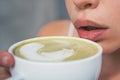 lips of woman drink japanese tea from cup. perfect morning with green coffee. matcha latte tea ceremony of girl