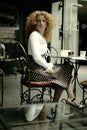 look of a happy woman in a Paris style cafe