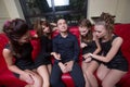 lovelace man surrounded by hot women wanting Royalty Free Stock Photo