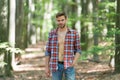 Sexy macho in unbuttoned shirt. young unshaven man has bare torso outdoor. male beauty and fashion. guy with bristle