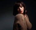makeup female model posing in warm wool sweater