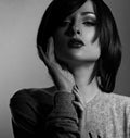 makeup woman with short bob hair style, dark lipstick touch