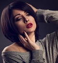 makeup woman with short bob hair style, red lipstick touchi Royalty Free Stock Photo