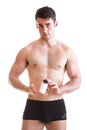 male body builder holding a boxes with supplements on his b Royalty Free Stock Photo