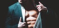 Sexy male body torso in suit. Business man undress suit on black background.