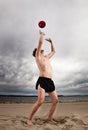 male with red ball on the beach Royalty Free Stock Photo