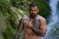 Sexy Man in Alps waterfall. Man freedom lifestyle. Live in nature. Hispanic man. Calmness and relax in nature. Naked Man