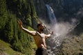 Sexy man in Alps waterfall. Man freedom lifestyle in nature. Hispanic man summer on nature. Calmness and relax in nature
