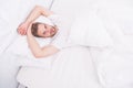 Sexy man in bed. early morning wakeup. lazy sunday with morning sex. man lying white bedroom. time to relax. male health Royalty Free Stock Photo
