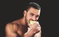Sexy man eat apple. Close up guy face. Royalty Free Stock Photo