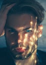 Sexy man face. Male beauty, skincare. Portrait guy in shadow.