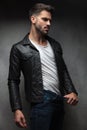 man in leather jacket showing how thin he is Royalty Free Stock Photo