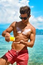 Man Tanning Using Sunscreen Cream On Body Skin. Summer Royalty Free Stock Photo