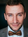 man in tuxedo and bow tie posing Royalty Free Stock Photo