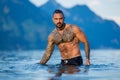 Sexy man in water. Topless male body. Sexy model. Seductive guy on nature. Handsome shirtless man in nature. Muscular Royalty Free Stock Photo