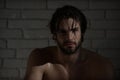 Sexy man with wet hair, muscular body in bath, shower Royalty Free Stock Photo