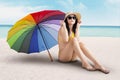 model with colorfull umbrella at beach