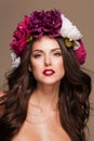 model with curle hair and bright flowers on