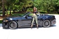 model in sport car beautiful girl with a Ford mustang Roush stage 3 900 HP horse power muscle car. Royalty Free Stock Photo