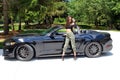 model in sport car beautiful girl with a Ford mustang Roush stage 3 900 HP horse power muscle car.