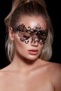 Sexy model woman in venetian masquerade carnival mask on black background. Glamour lady Royalty Free Stock Photo