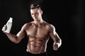 Sexy muscular male torso and body of handsome macho man or athlete guy workout or training, holds white thermo mug Royalty Free Stock Photo