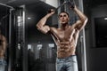 muscular man working out in gym, shaped abdominal. Strong male naked torso abs