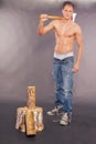 muscular young man chopping fire wood Royalty Free Stock Photo