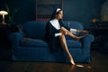 Sexy nun paints her toenails with nail polish Royalty Free Stock Photo