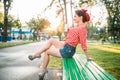 pinup girl holds cardboard cup with a straw Royalty Free Stock Photo