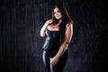 Sexy plus size model in black corset, fat woman with big natural breasts on dark background, body positive concept Royalty Free Stock Photo