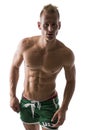 portrait of a very muscular blond shirtless male model