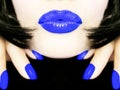 pretty woman with black bob hair blue smerf lips fingernails sending a kiss smooch Royalty Free Stock Photo