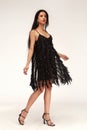 Sexy pretty woman tanned skin long brunette dark hair bright makeup wear fashion party style sequins little black dress for