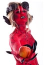 red devil woman holding an apple