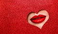 Sexy Red Lips Makeup Close up. Beauty Red Lipstick Make up look out Heart Hole Glitter Red Color Paper Background Copy Space.