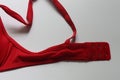 Sexy red straps and hooks of seamless smooth luxury elegant women push up bra on white background. Royalty Free Stock Photo