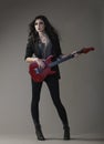 rocker chic in black with red guitar Royalty Free Stock Photo