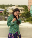 Sexy and romantic Indian girl with moist eyes and dressed in green shirt and hair scattered with red and gorgeous red lip