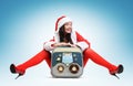 Santa girl with vintage tape recorder