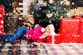 Sexy Santa woman posing on vintage wooden background. Portrait of beautiful girl wearing Santa clothes. Christmas Royalty Free Stock Photo