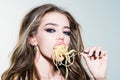 Sexy seductive cheeky girl eats a pasta.