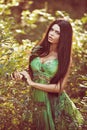 sensual very beautiful girl brunette in green dress outdoor