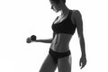 slim fit woman body with dumbbells. Muscled abdomen. Sports Royalty Free Stock Photo