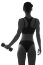 slim fit woman body with dumbbells. Muscled back. Sportswea Royalty Free Stock Photo