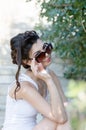 slim lady wear tight short white dress and sunglasses Royalty Free Stock Photo