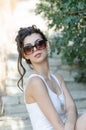 slim lady wear tight short white dress and sunglasses Royalty Free Stock Photo