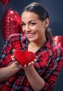 and smiling woman holding red heart Royalty Free Stock Photo