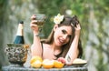 Sexy summer tropical fruit. Young beautiful model on vacation holiday outdoor. Beautiful Young Woman Drinking Wine In Royalty Free Stock Photo